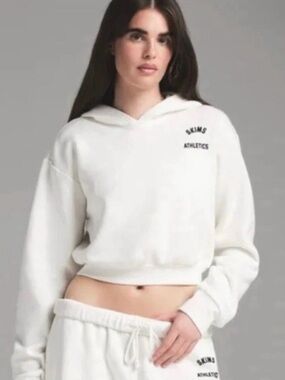 SKIMS White Cropped Hoodie with 'ATHLETICS' Logo